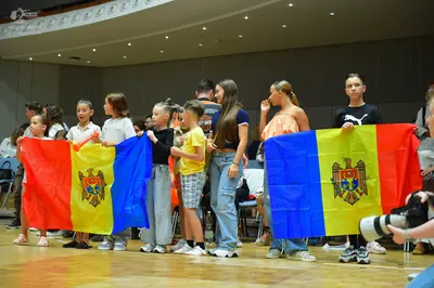 Dancesport competitor: The individuals are wearing casual clothing rather than dance competition costum