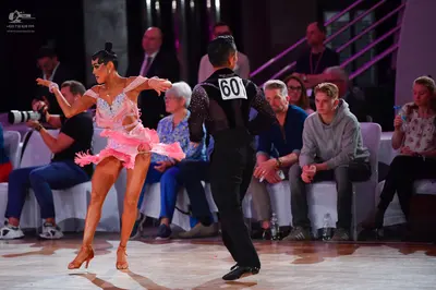 Dancesport competitor #601: Female dancer: pink Latin dance dress with sequins and lace