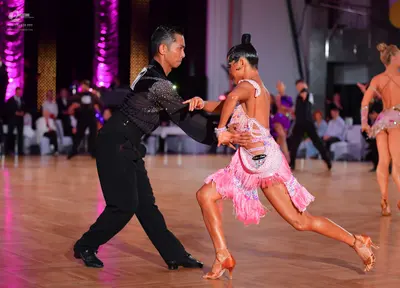 Dancesport competitor: Male dancer: black long-sleeved shirt with silver sequins on the shoulder/upper 