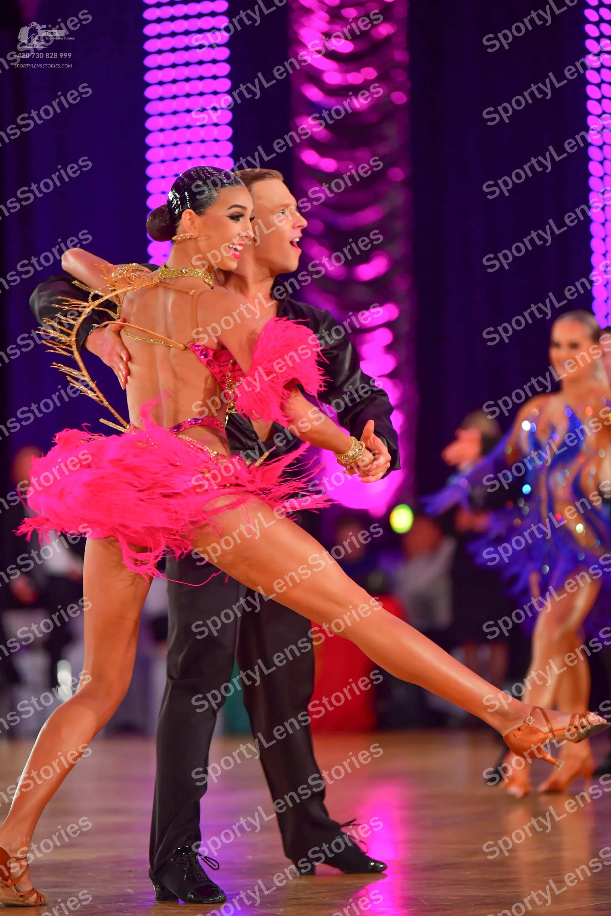 Dancesport competitor: Male dancer: black long-sleeved shirt and black trousers