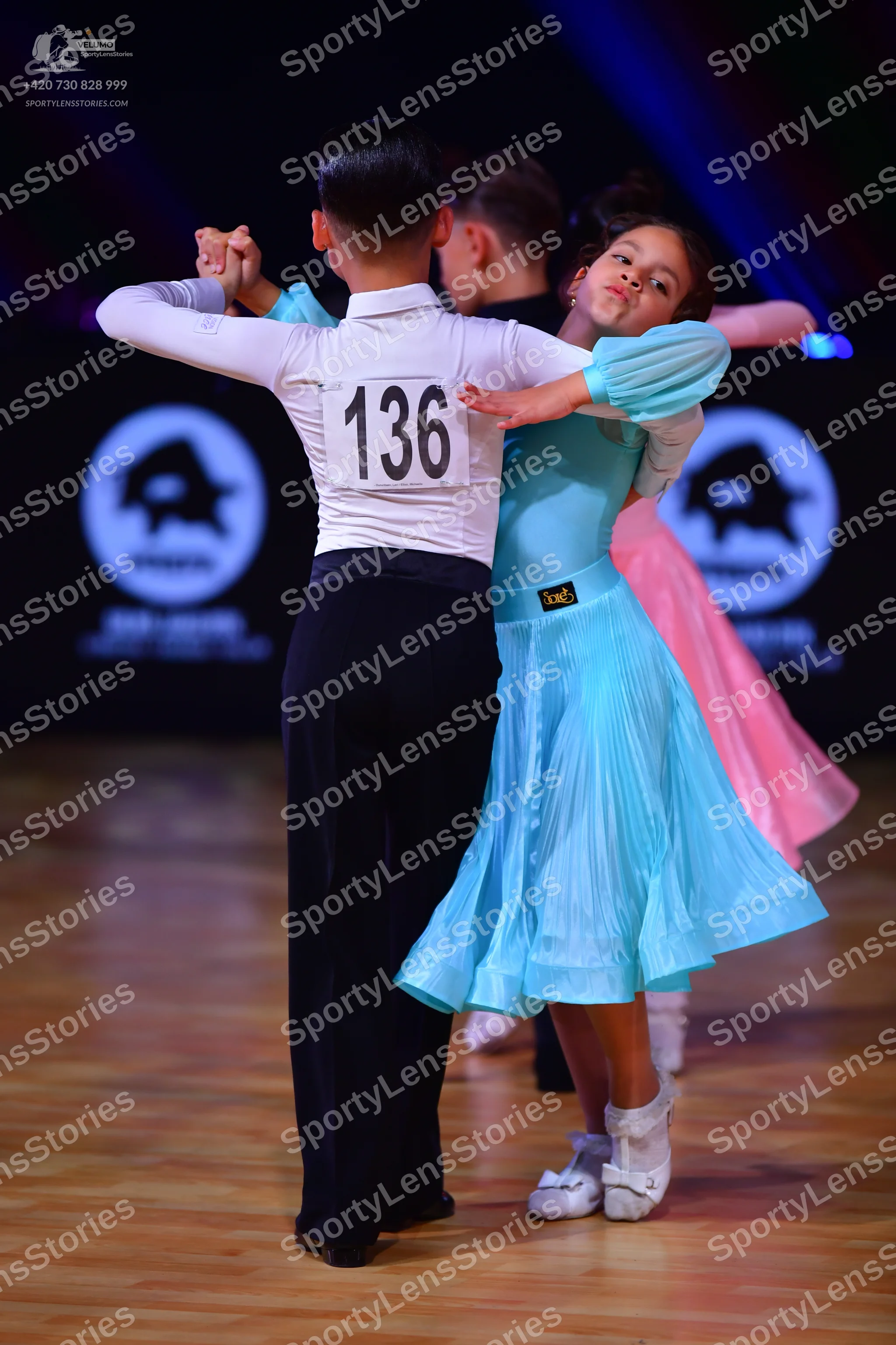 Dancesport competitor: Male dancer: white long-sleeved shirt and black trousers