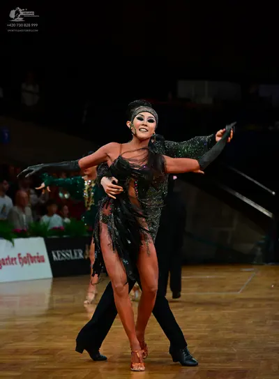 Dancesport competitor: Male dancer: black trousers and a black top