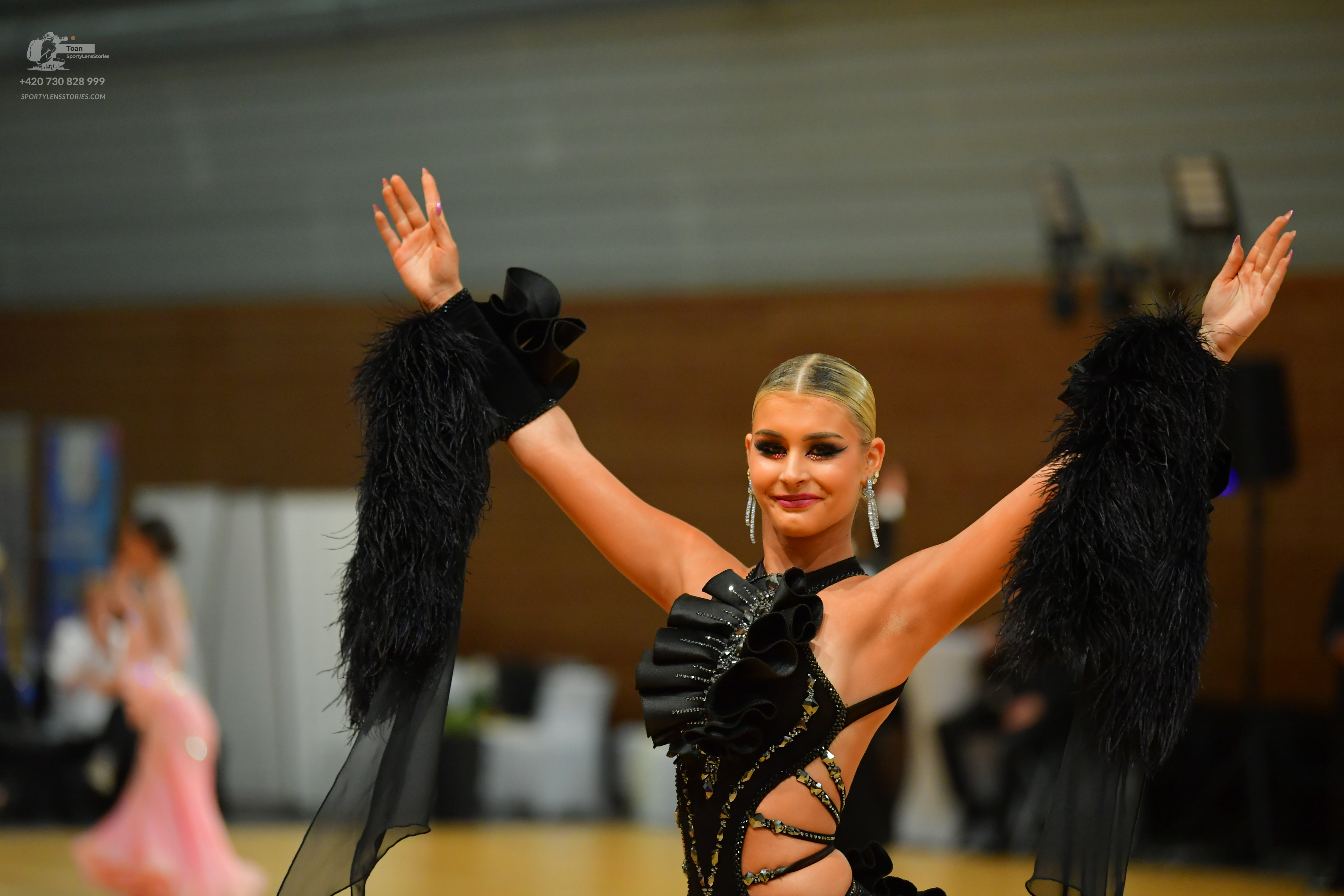 Dancesport competitor: ** Black Latin Dress
*   **Color:** Predominantly black with silver and iridesce
