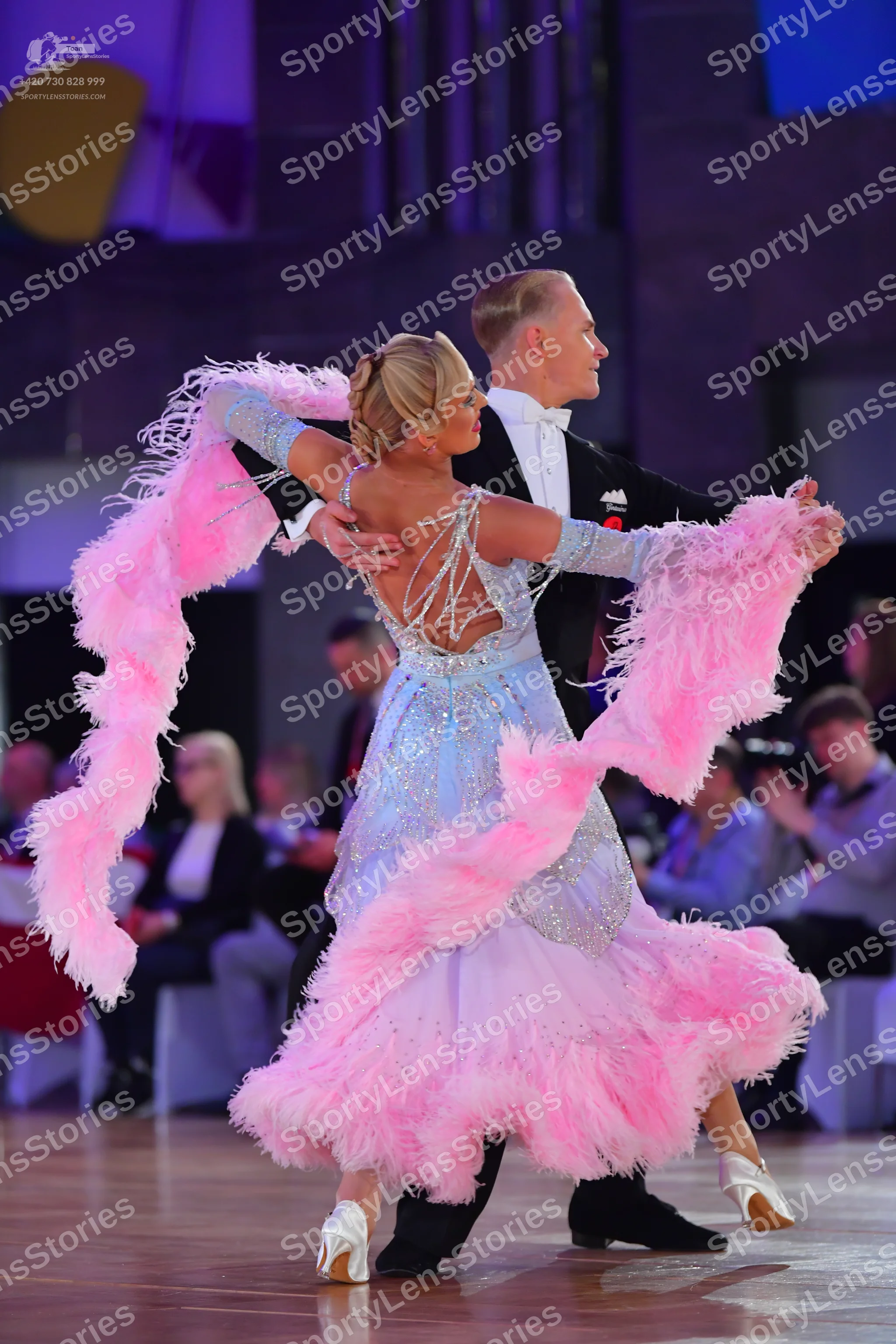 Dancesport competitor: Male dancer: black tuxedo with a white shirt and black bowtie