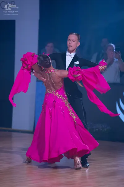 Dancesport competitor: Male dancer: black suit with a white shirt, white bowtie, and a white pocket squ