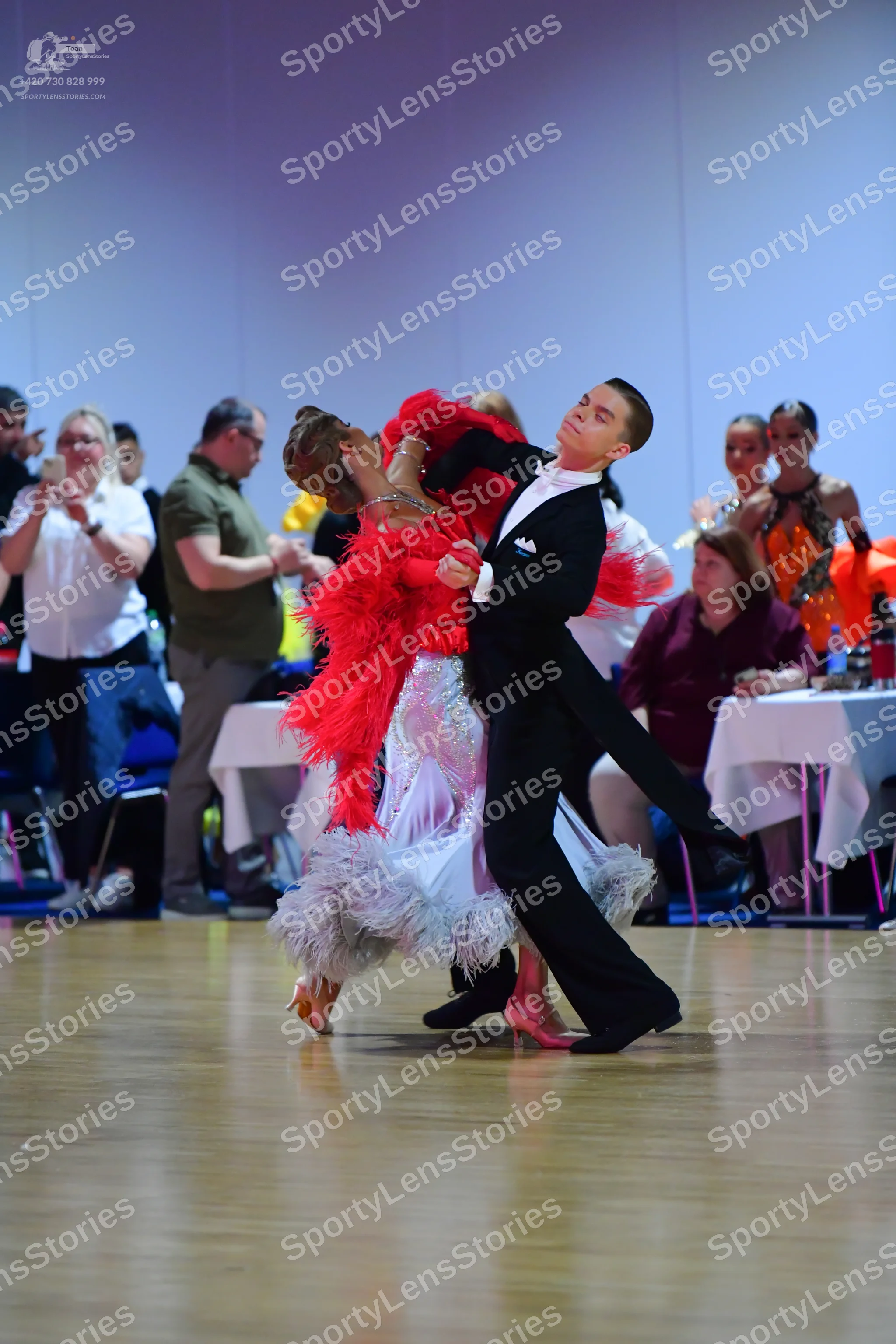 Dancesport competitor: Male dancer: black suit with a white shirt