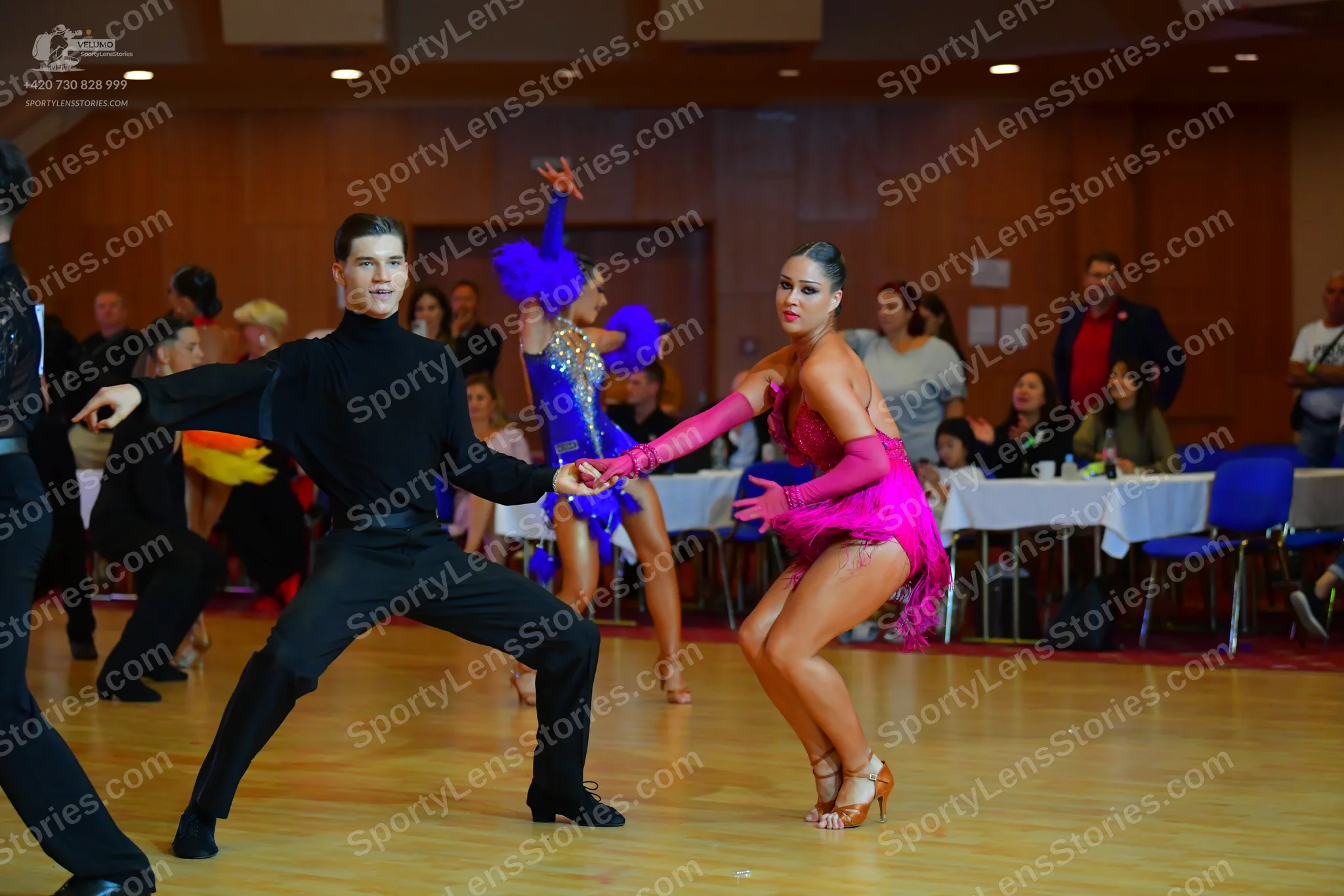 Dancesport competitor: Male dancer: black long-sleeved top and black trousers