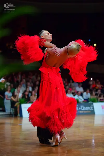 Dancesport competitor: Male dancer: black suit
