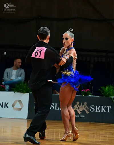 Dancesport competitor #61: Male dancer: black long-sleeved shirt and black trousers