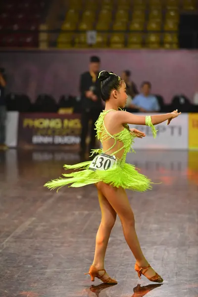 Dancesport competitor #430: Female dancer: neon green Latin dance dress with long fringe