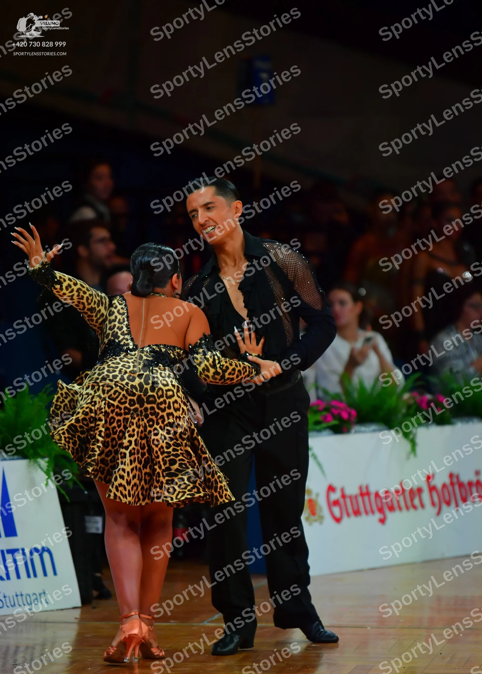 Dancesport competitor: Male dancer: black long-sleeved shirt with sheer mesh detail on the shoulder and