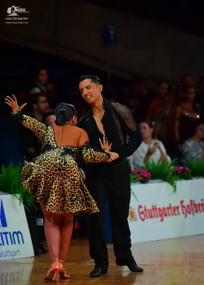 Dancesport competitor: Male dancer: black long-sleeved shirt with sheer mesh detail on the shoulder and