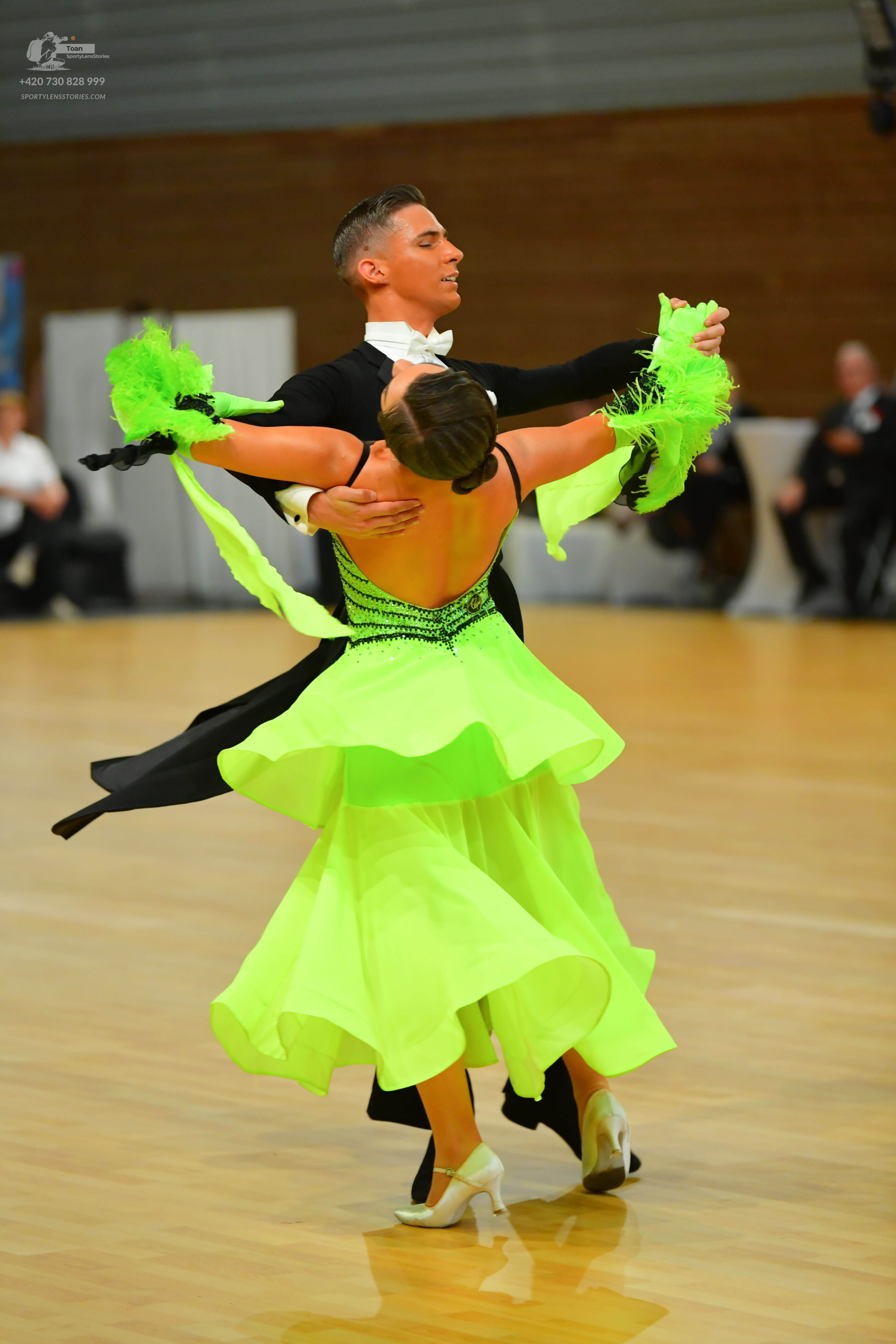 Dancesport competitor: Male:** Black suit with a sequin lapel and a tail