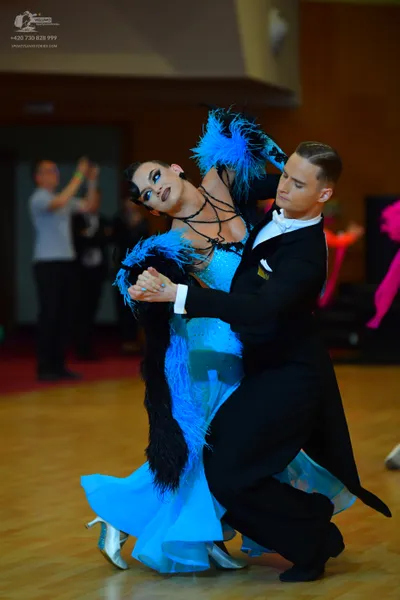 Dancesport competitor: Male dancer: black tailcoat, white shirt, and white bowtie