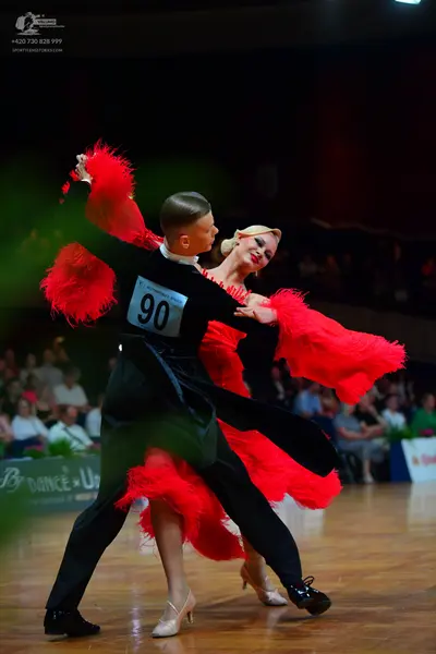 Dancesport competitor #90: Male dancer: black long-sleeved dance top and black trousers