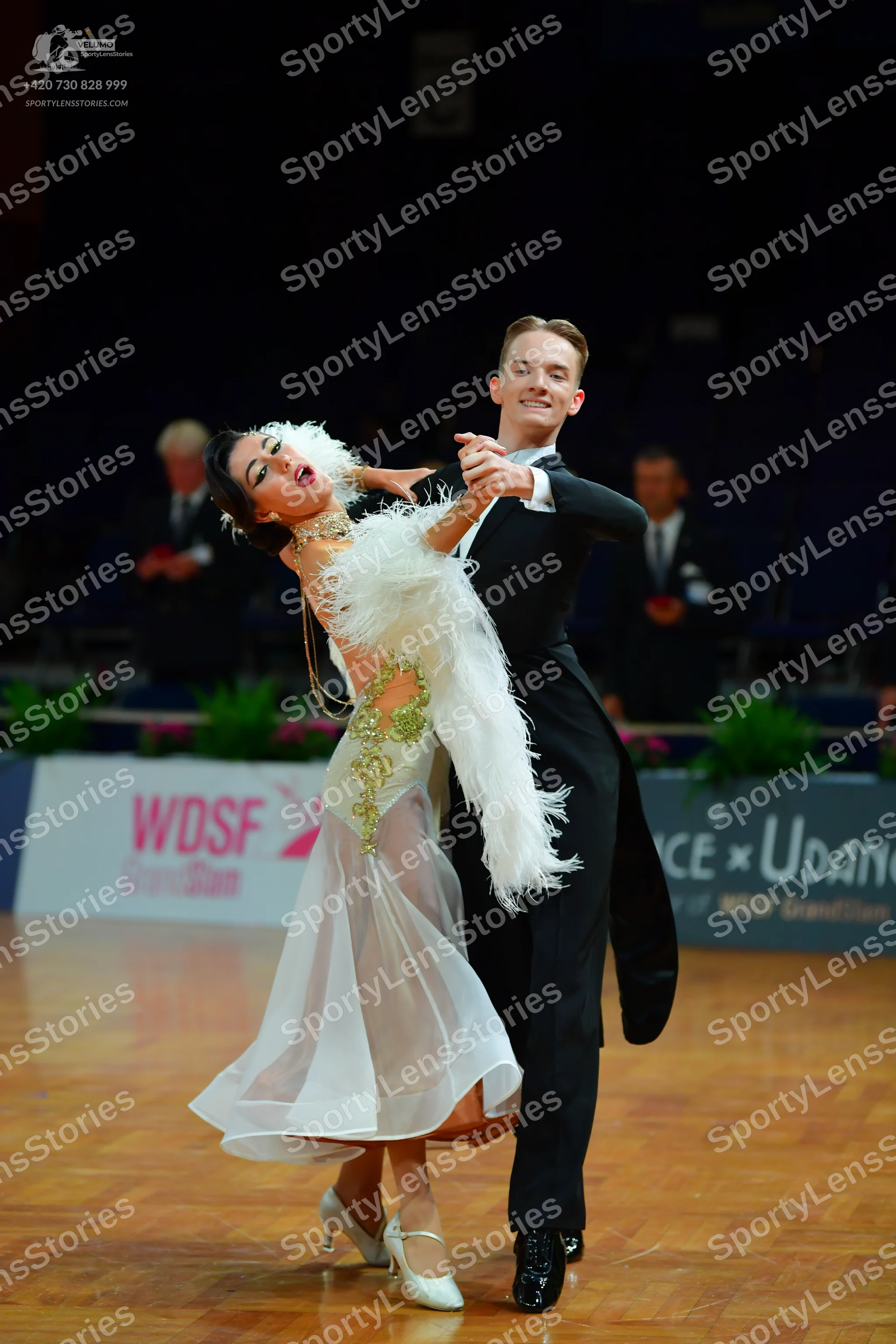 Dancesport competitor: Male dancer: black suit, white shirt, and black bowtie