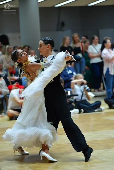 Dancesport competitor: Male dancer: black suit