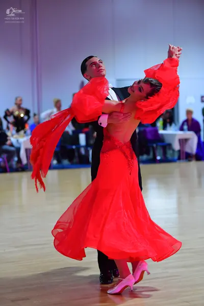Dancesport competitor: Male dancer: black suit and trousers with a white shirt