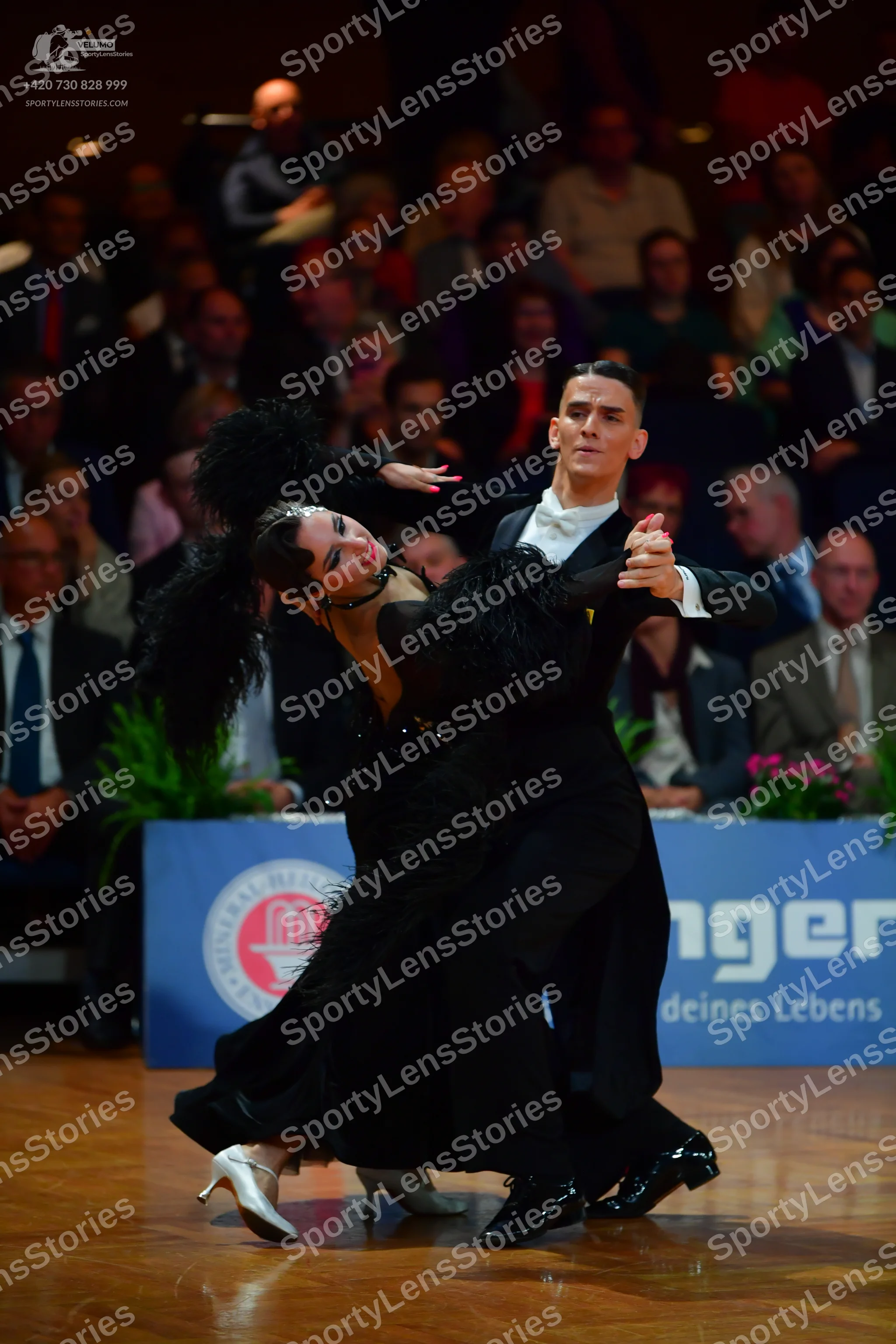 Dancesport competitor: Male dancer: black suit with a white shirt and black patent leather shoes