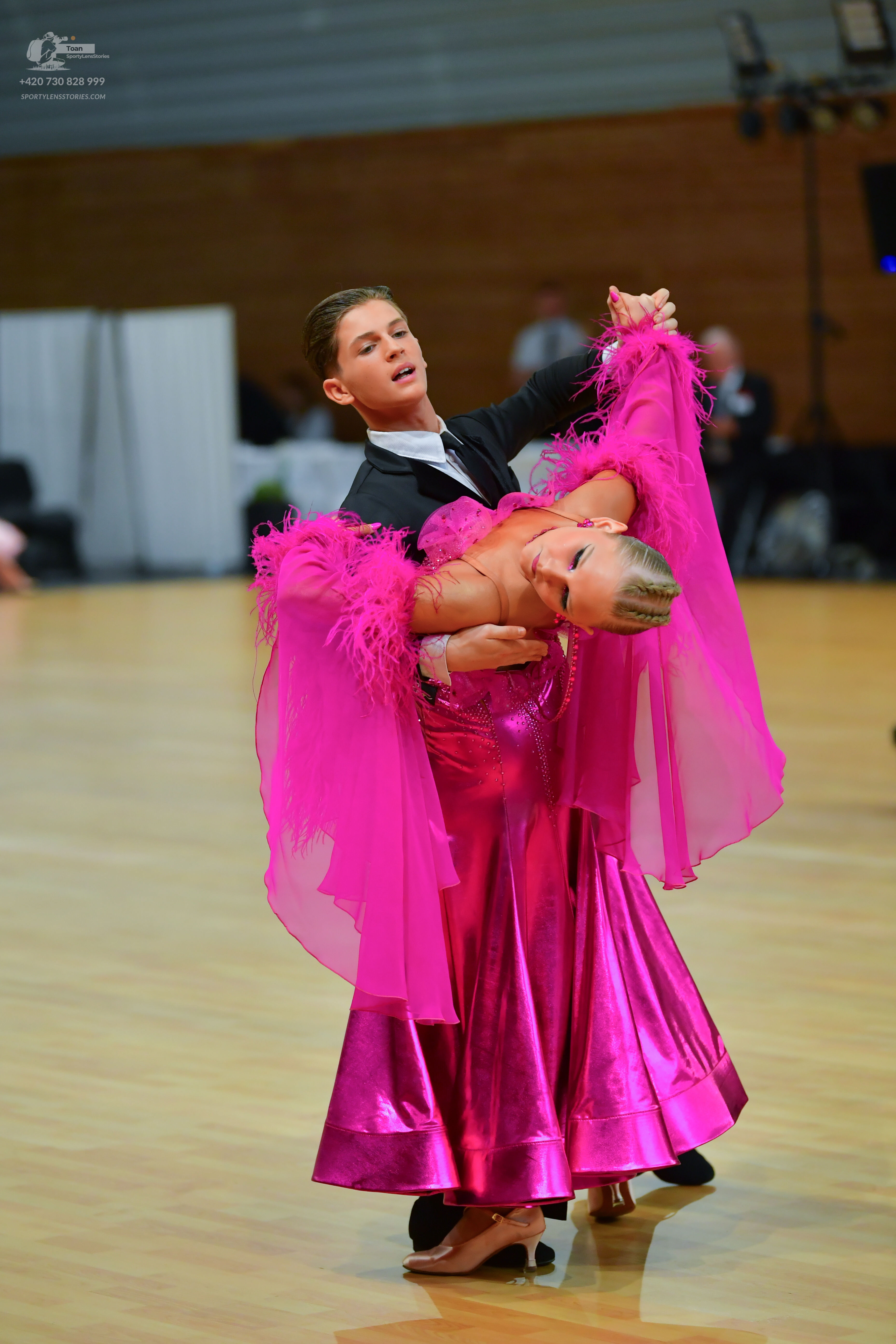 Dancesport competitor: ** Black tailsuit
*   **Fabric:** Sequins
*   **Style:** Tail suit with sequin l