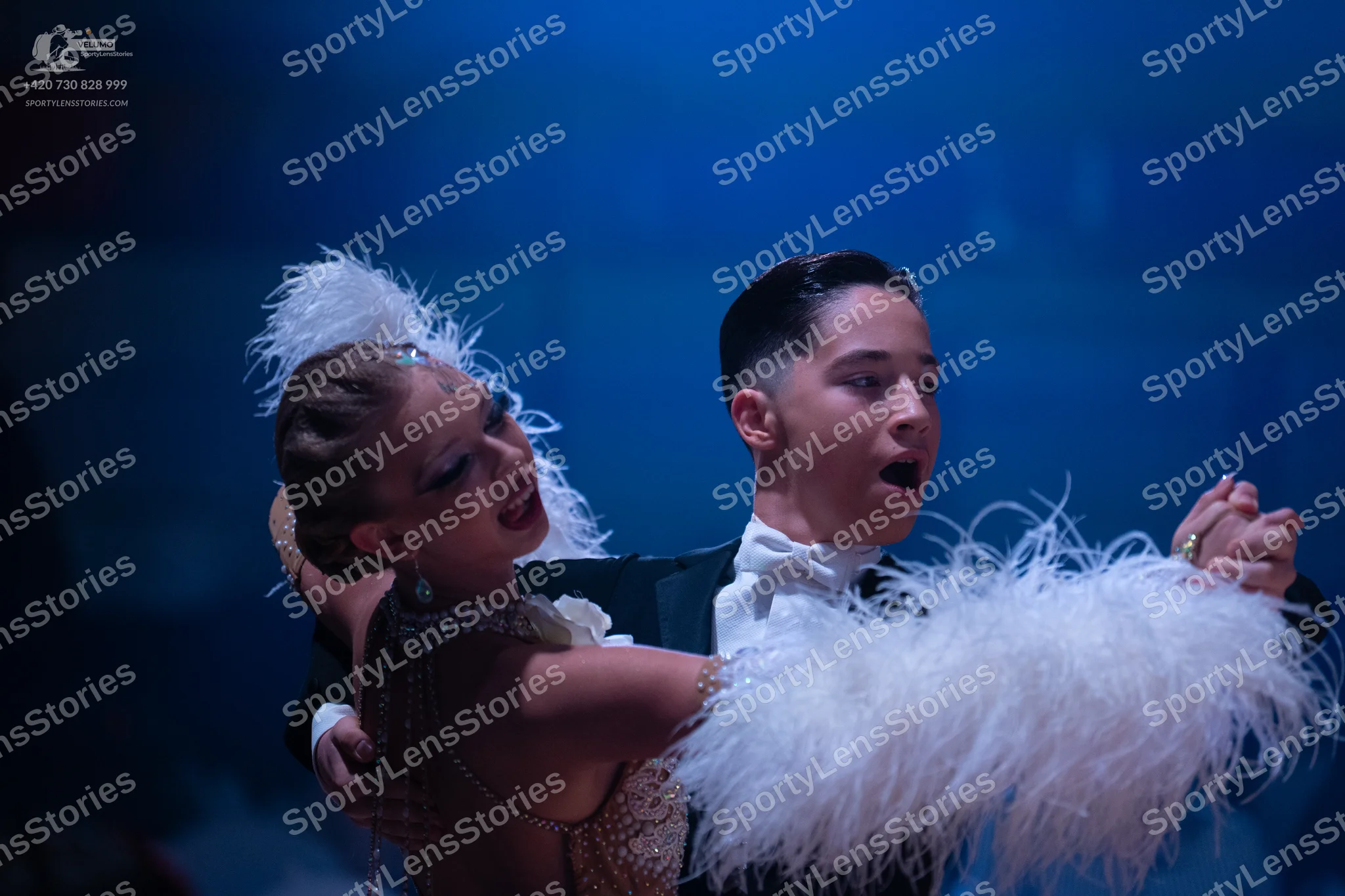 Dancesport competitor: Male dancer: black suit with a white shirt