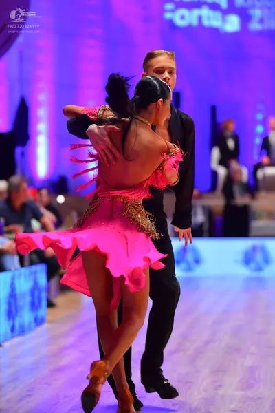 Dancesport competitor: Male dancer: black suit