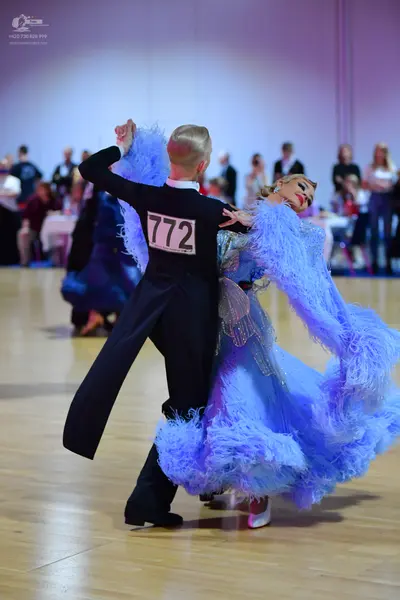 Dancesport competitor #772: Male dancer: black long-sleeved shirt and black trousers