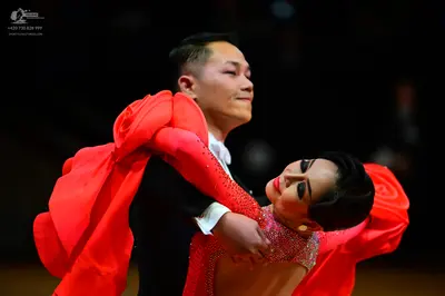 Dancesport competitor: Male dancer: black suit with a white shirt