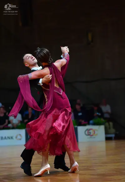 Dancesport competitor: Male dancer: black suit with white shirt and white bowtie