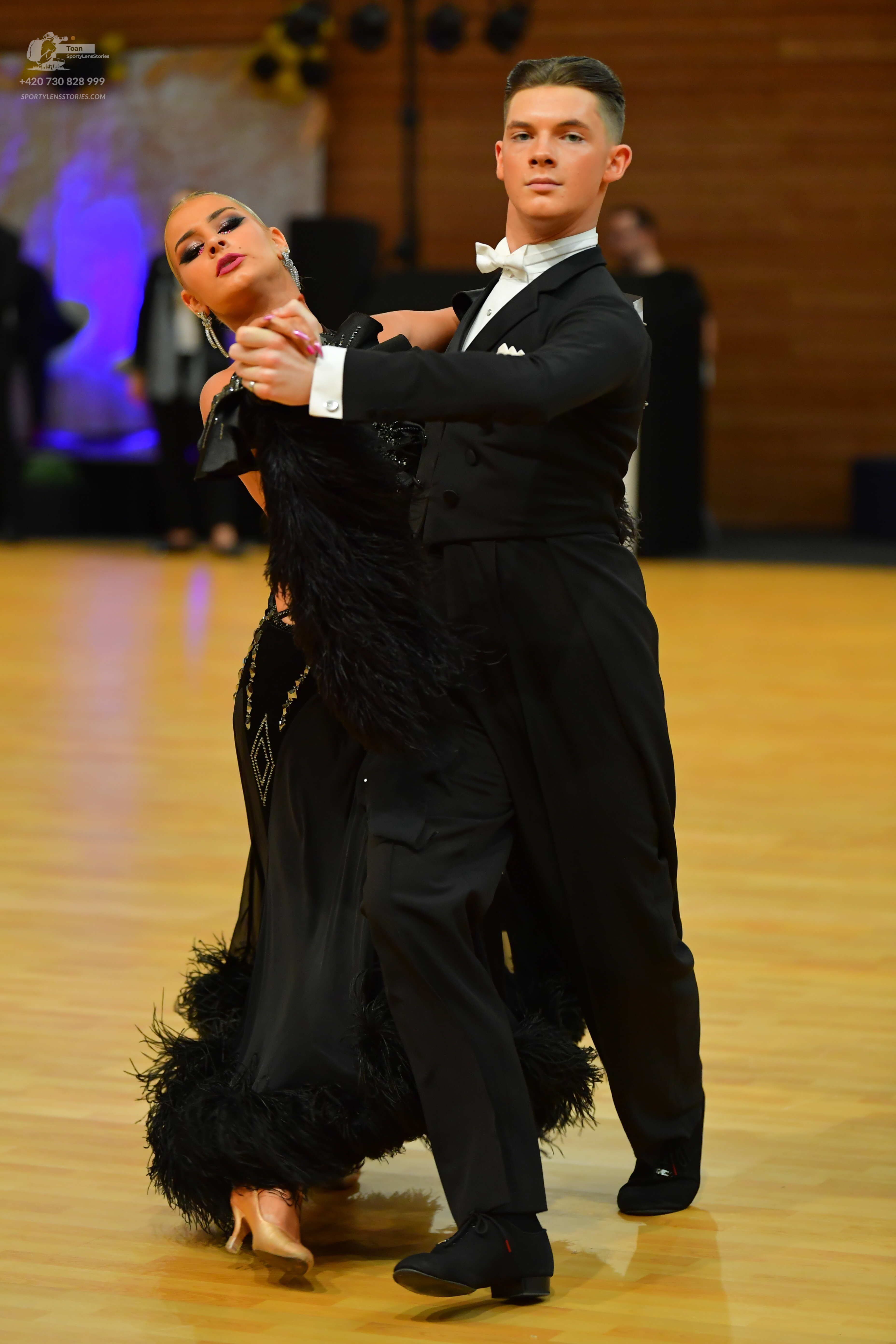 Dancesport competitor: ** Black tailsuit with sequin lapels