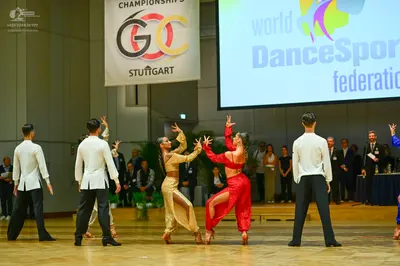 Dancesport competitor: Male dancers: white long-sleeved shirts and black trousers