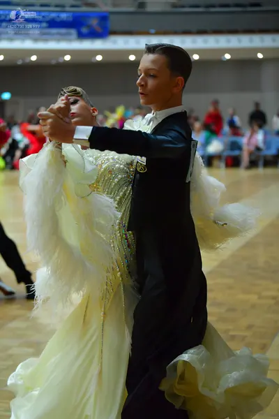 Dancesport competitor: Male dancer: black ballroom suit