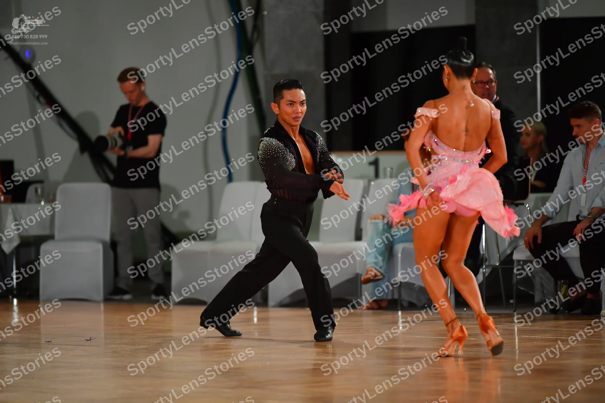Dancesport competitor: Male dancer: black long-sleeved shirt with sequin detailing on the chest and sho
