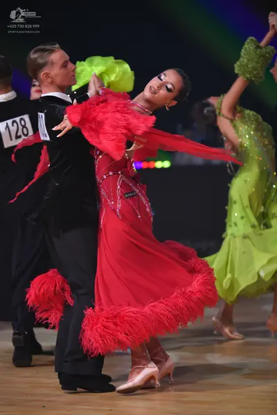 Dancesport competitor: Male dancer: black suit with a white shirt