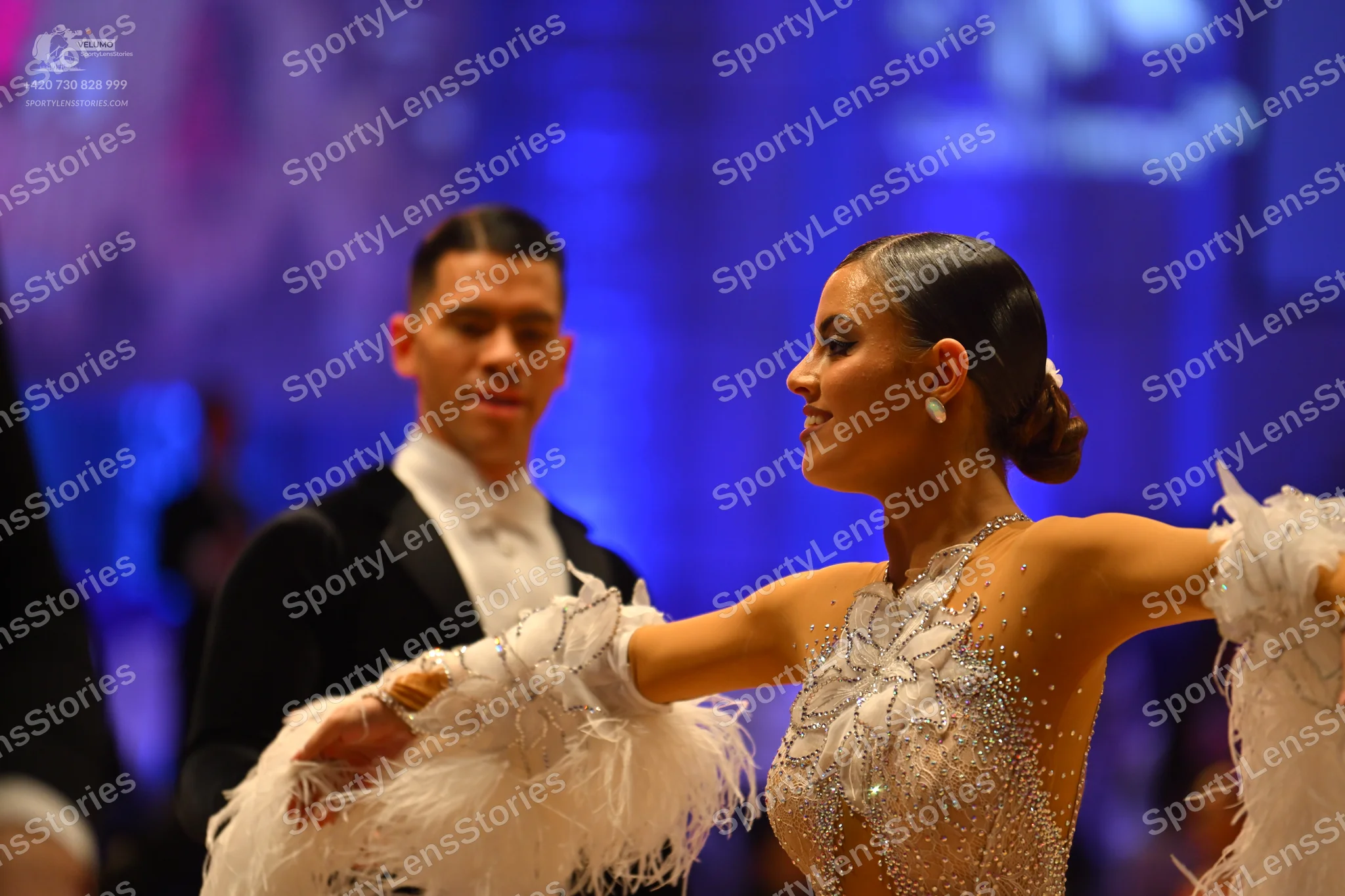 Dancesport competitor: Male dancer: black suit with a white shirt and white bow tie