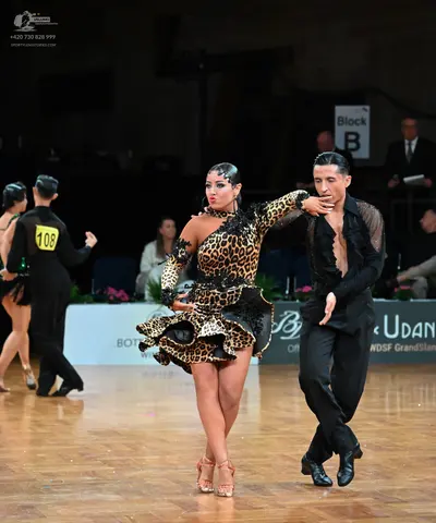 Dancesport competitor #108: Male dancer (left): black long-sleeved shirt and black trousers
