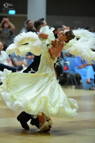Dancesport competitor: Male dancer: black suit