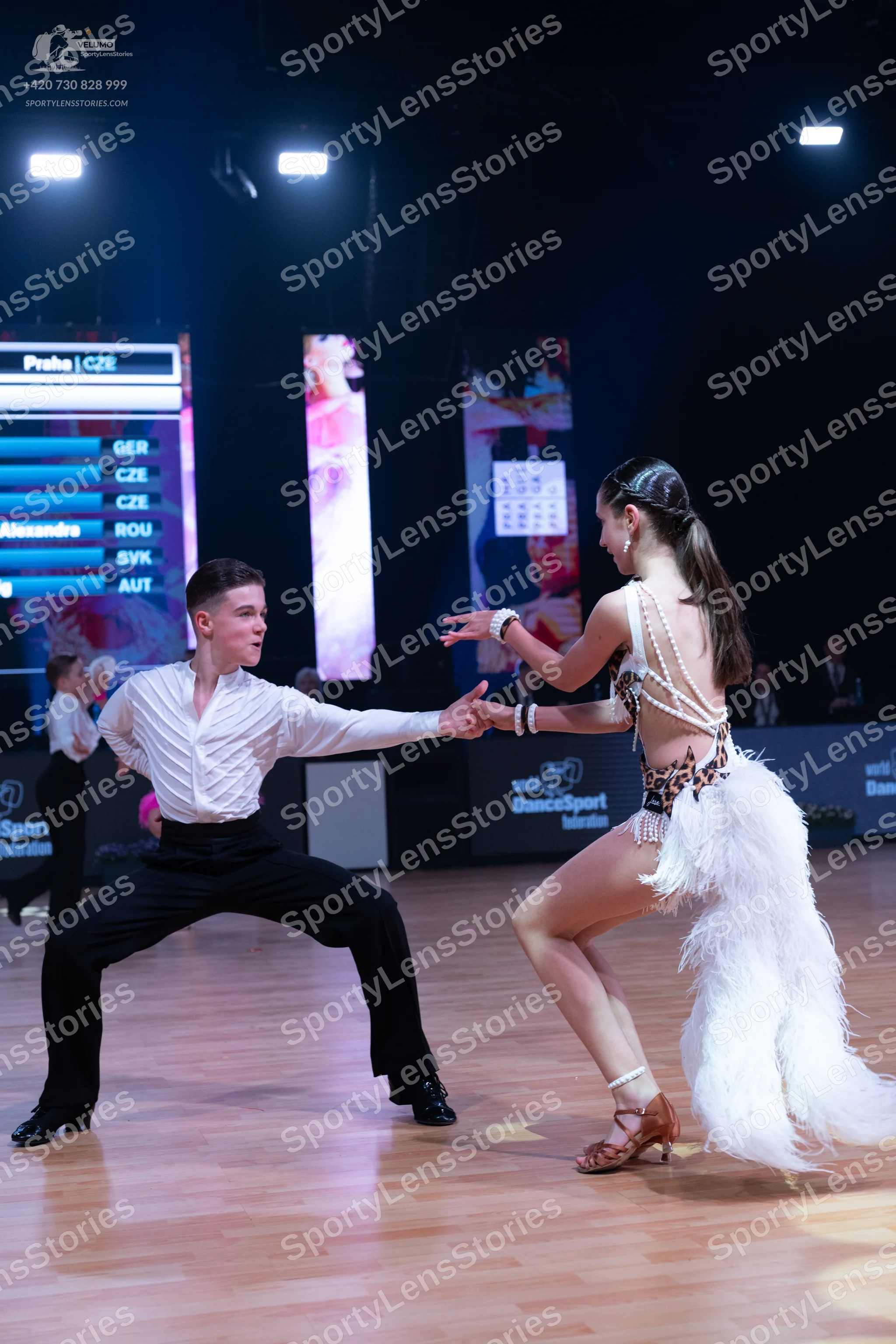 Dancesport competitor: Male dancer: white long-sleeved shirt and black trousers