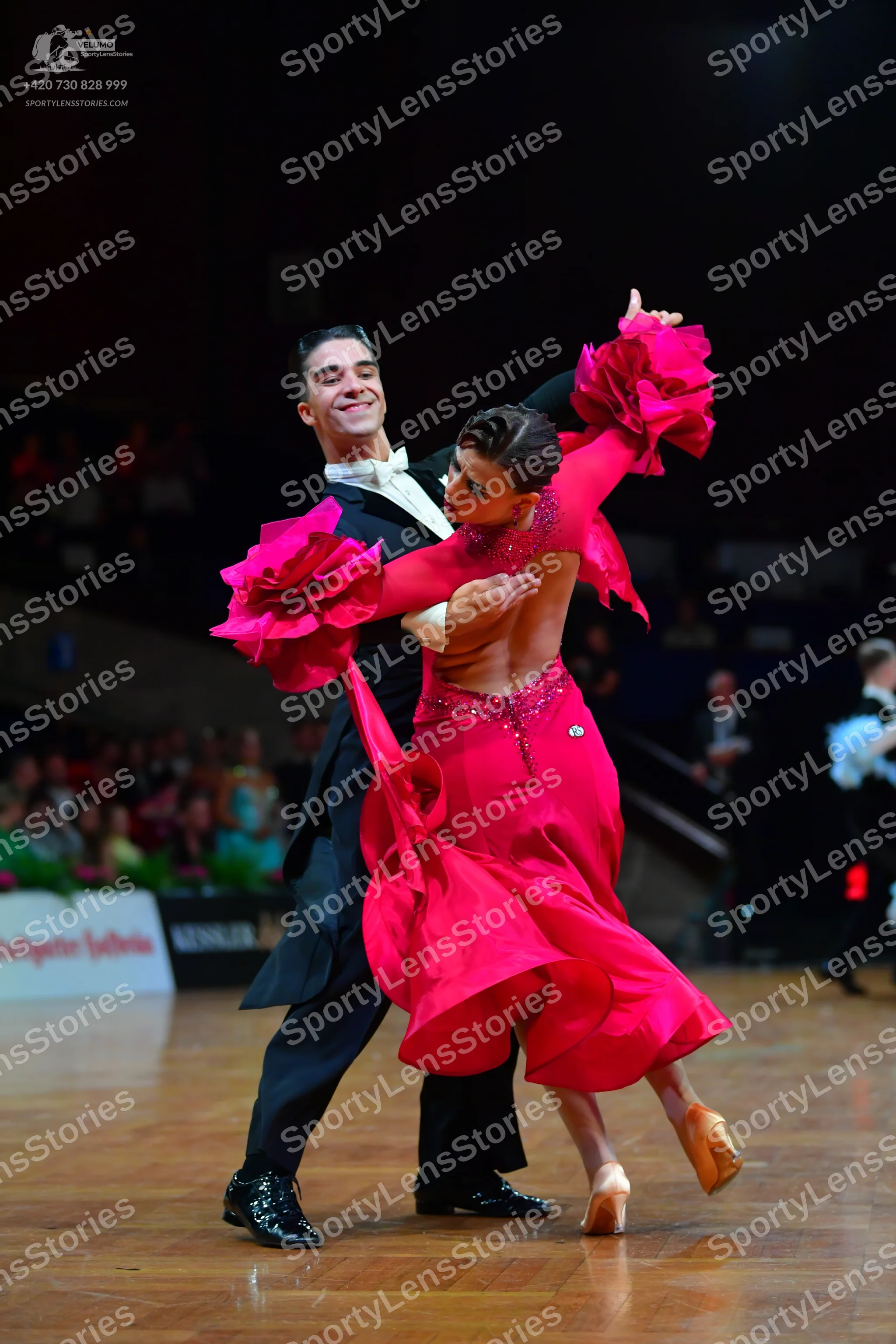 Dancesport competitor: Male dancer: black tailcoat, white shirt, black bowtie, and black patent leather