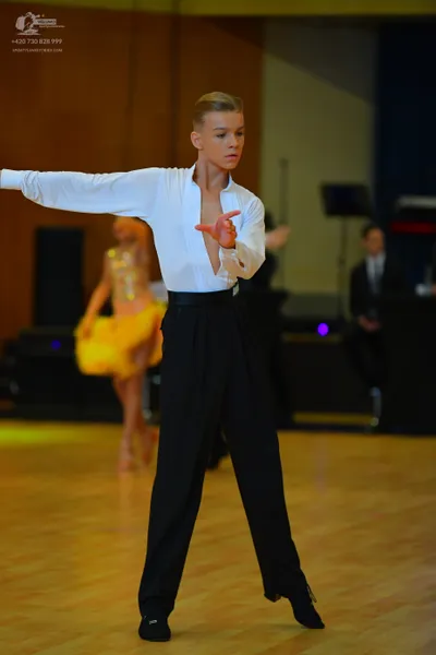Dancesport competitor: Male dancer: white long-sleeved shirt and black trousers