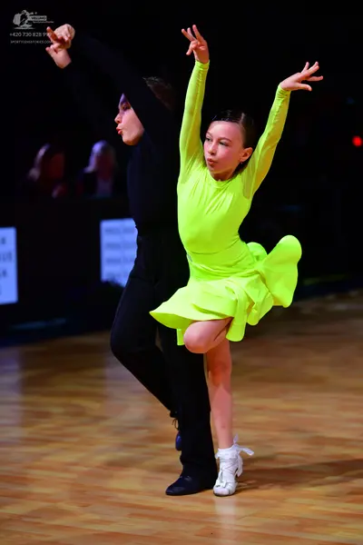 Dancesport competitor: Male dancer: black long-sleeved top and black trousers
