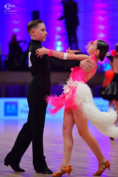 Dancesport competitor: Male dancer: black long-sleeved shirt and black trousers