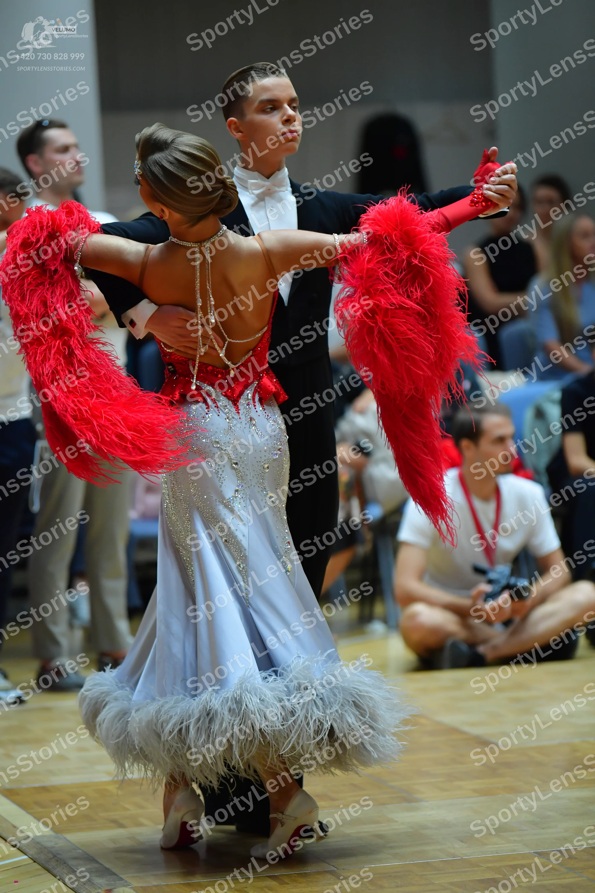 Dancesport competitor: Male dancer: black suit with a white shirt and white bow tie