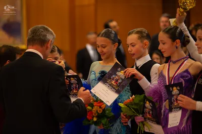 Dancesport competitor: Man in foreground: black suit