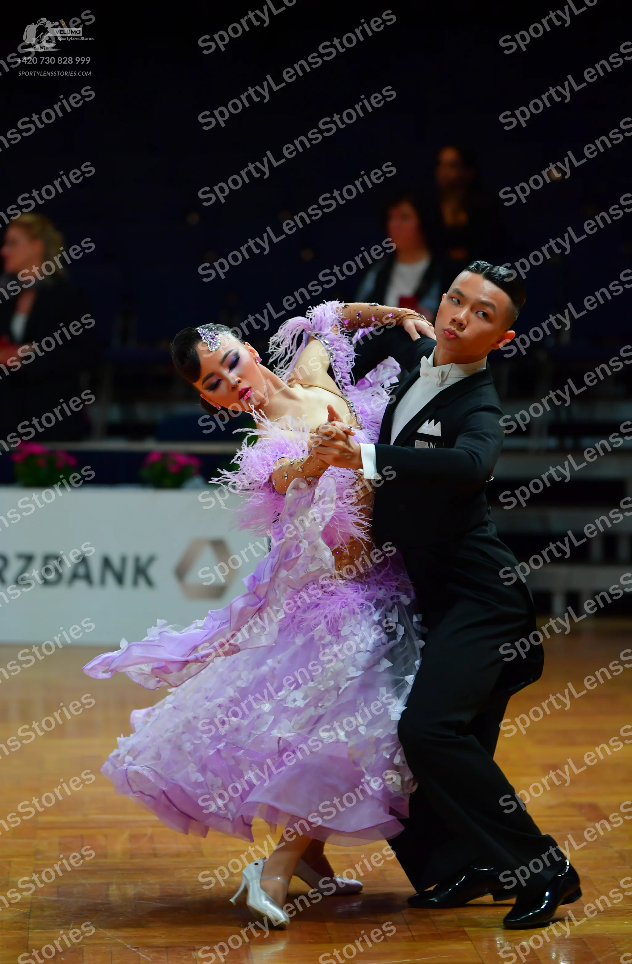 Dancesport competitor: Male dancer: black suit with a white shirt