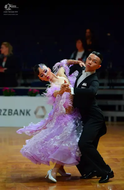 Dancesport competitor: Male dancer: black suit with a white shirt