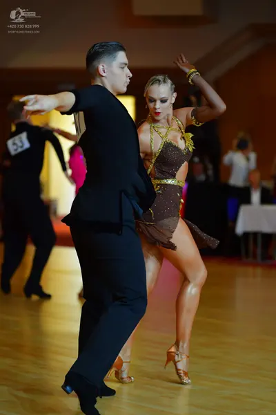 Dancesport competitor #53: Male dancer: black long-sleeved dance top and black trousers