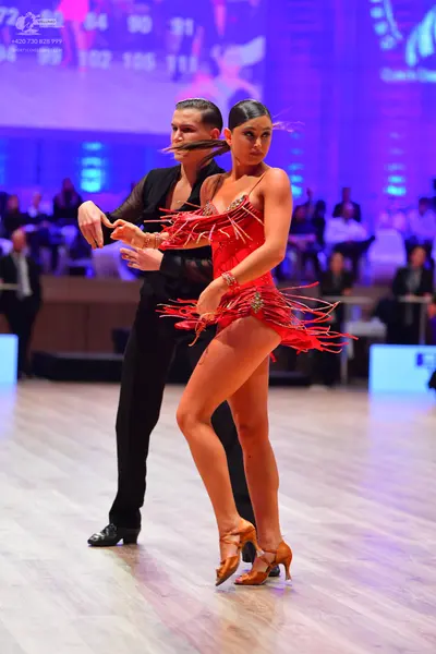 Dancesport competitor: Male dancer: black dance outfit