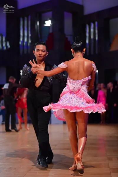 Dancesport competitor: Male dancer: black long-sleeved shirt with a deep V-neck and shimmering details 
