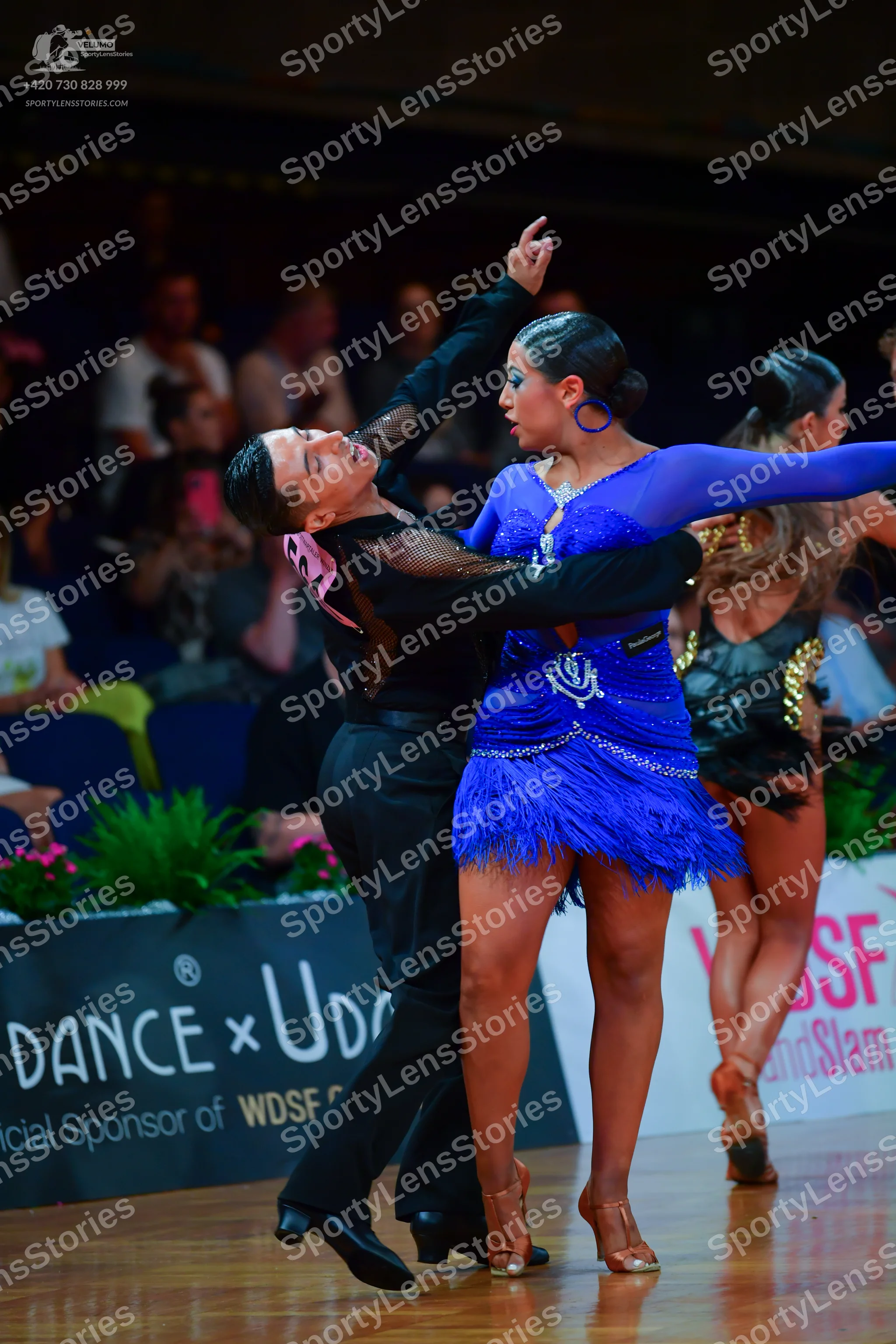 Dancesport competitor: Male dancer: black long-sleeved dance top with mesh sleeve detailing and black t
